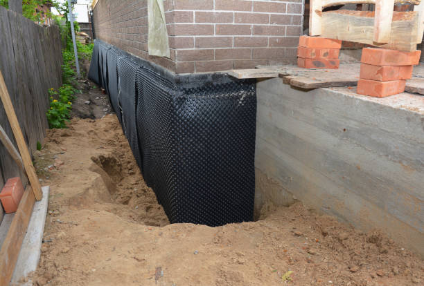 Happy homeowners after waterproofing job in Hartville